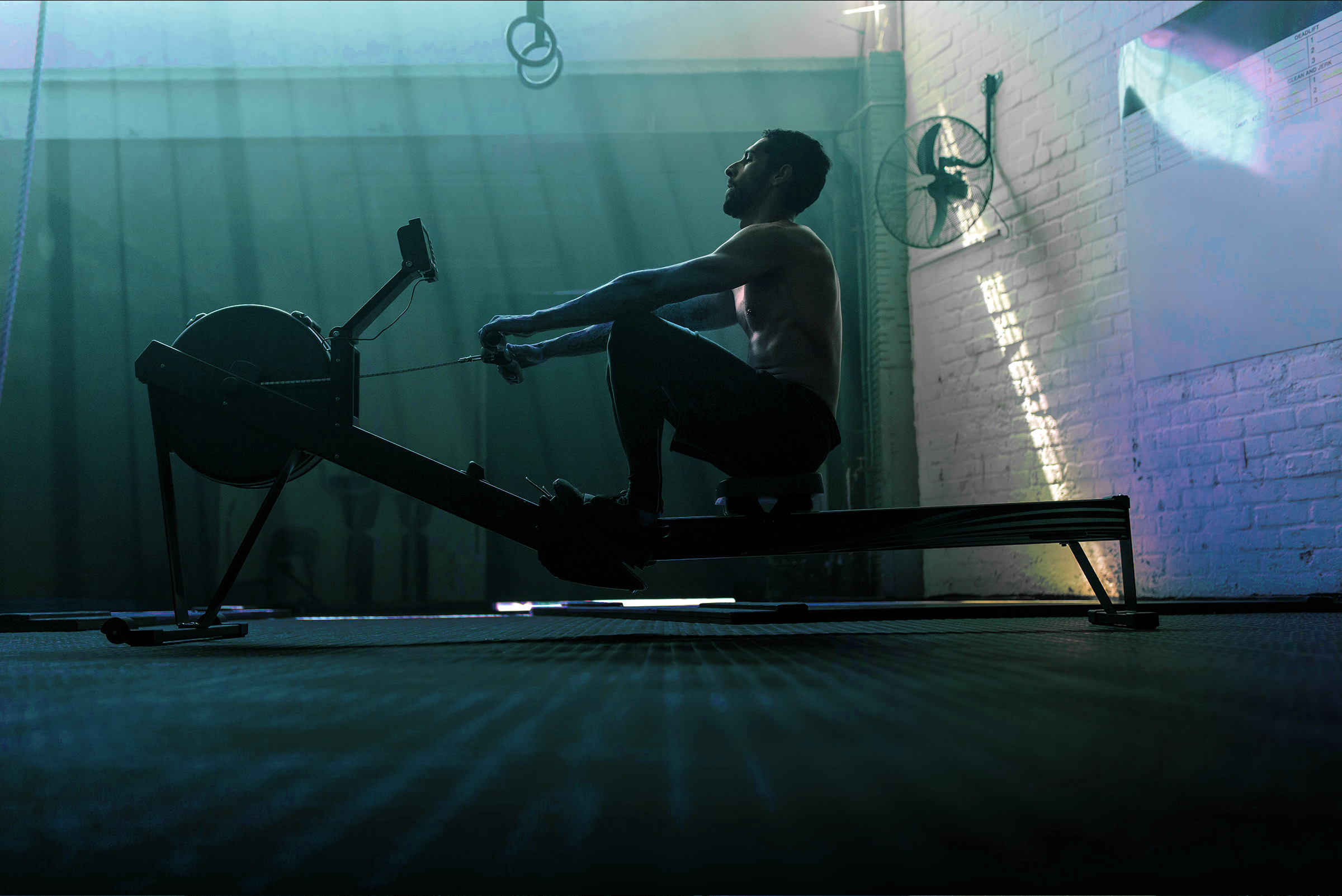 Male on a rowing machine