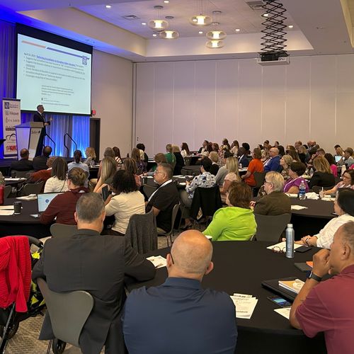 Room full of professionals meeting