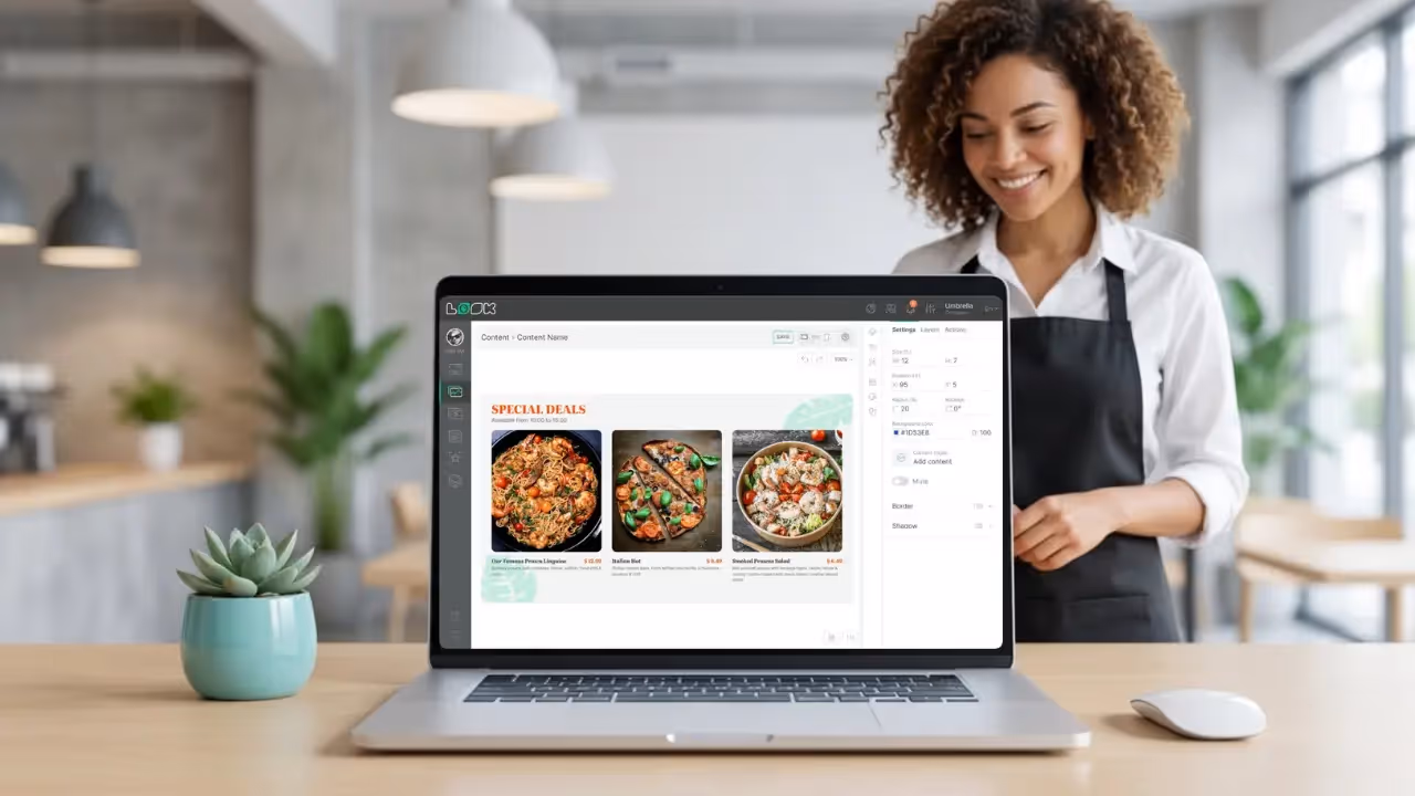 A laptop displaying a user-friendly digital signage software dashboard with various management sections, illustrating ease of use for restaurant managers.