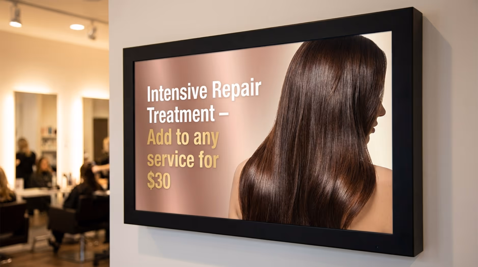 Close-up of a digital screen in a salon displaying a colorful promotion for a deep conditioning treatment with shiny hair imagery.