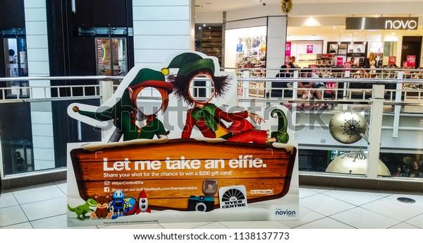 Brisbane Queensland Australia 12 22 2014 Let me take a elfie Photo poster that people can put their heads in and take a picture set up in The Myer Center on Queen Street Mall