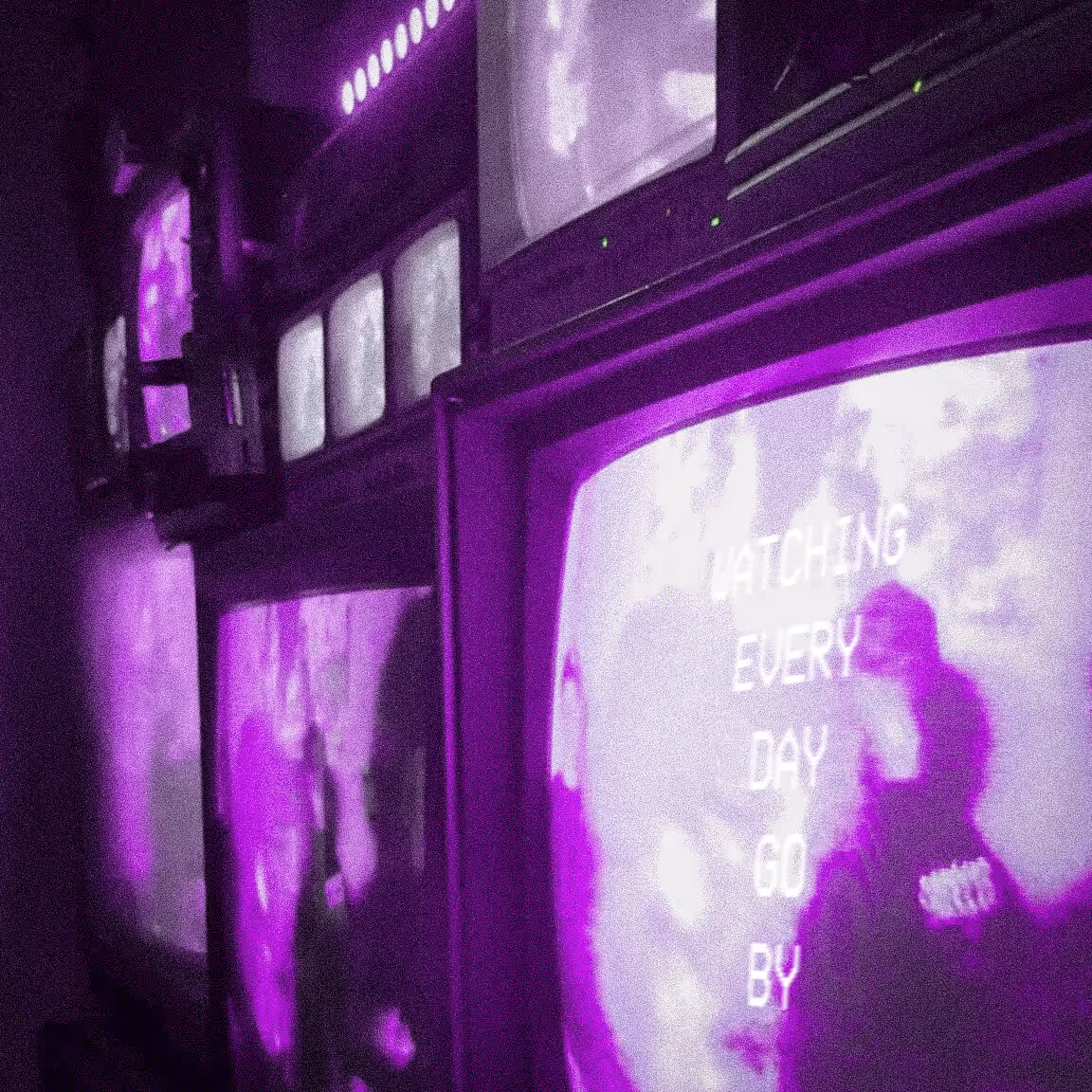 Cover artwork for the single “Watching Every Day Go By” by BOSKO WITH A K, my independent artist project [lofi analog CRT monitors with purple static]