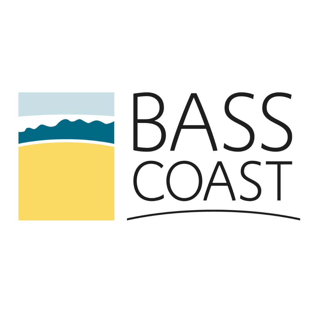 Bass Coast logo with stylized blue waves, light blue sky, and yellow beach rectangle