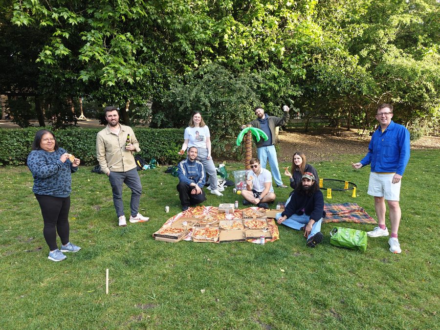 Team pizza picnic in the park