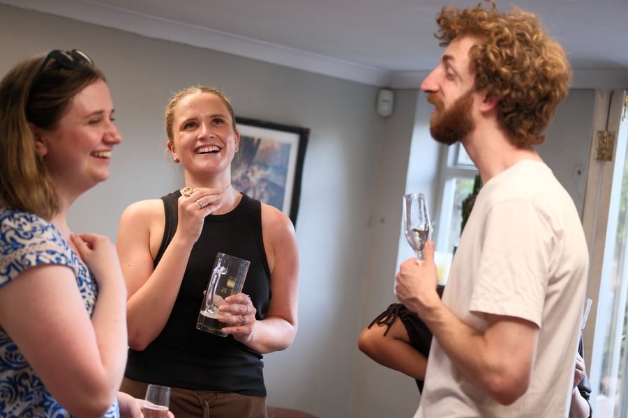 Loomers laughing together at a team social