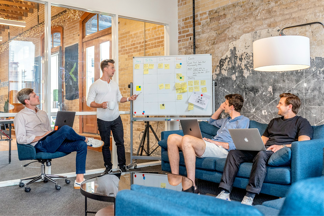 A product team working through a planning board together