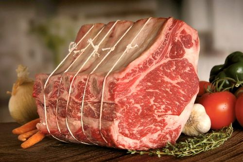 Standing raw rib roast prepared to cook