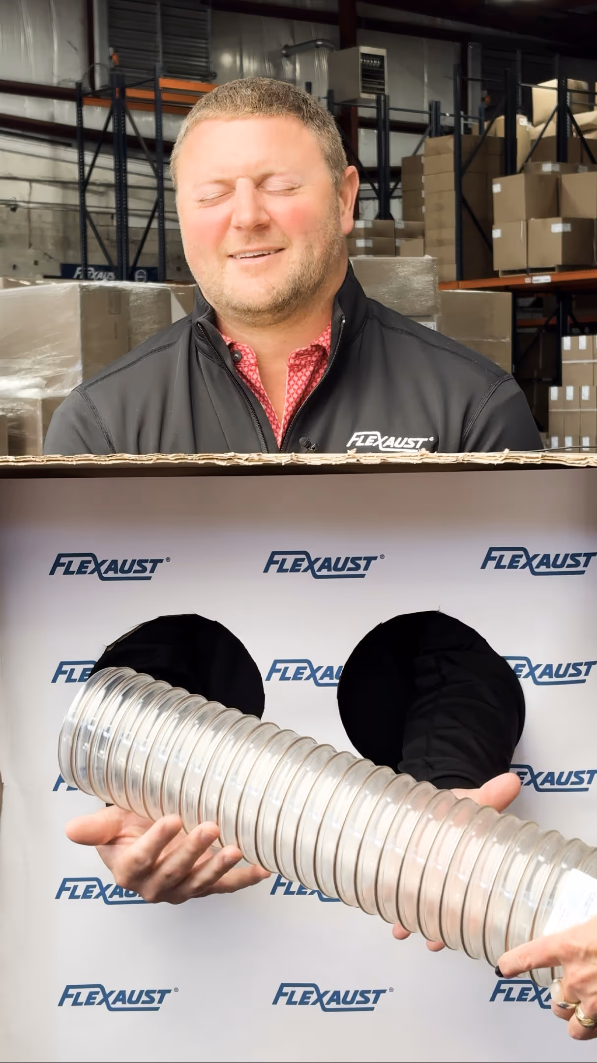 person trying to guess a hose by feel with hose inside box