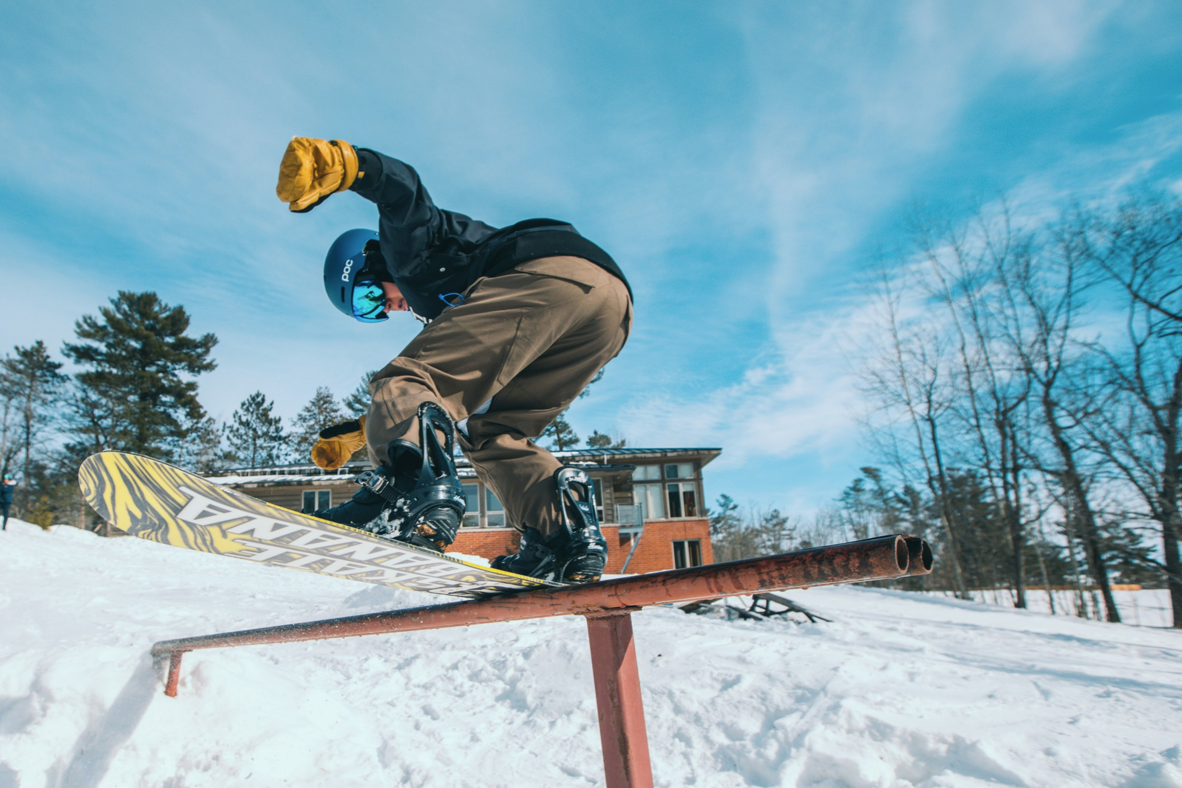 Making great use of our campus snow board park on a sunny day.