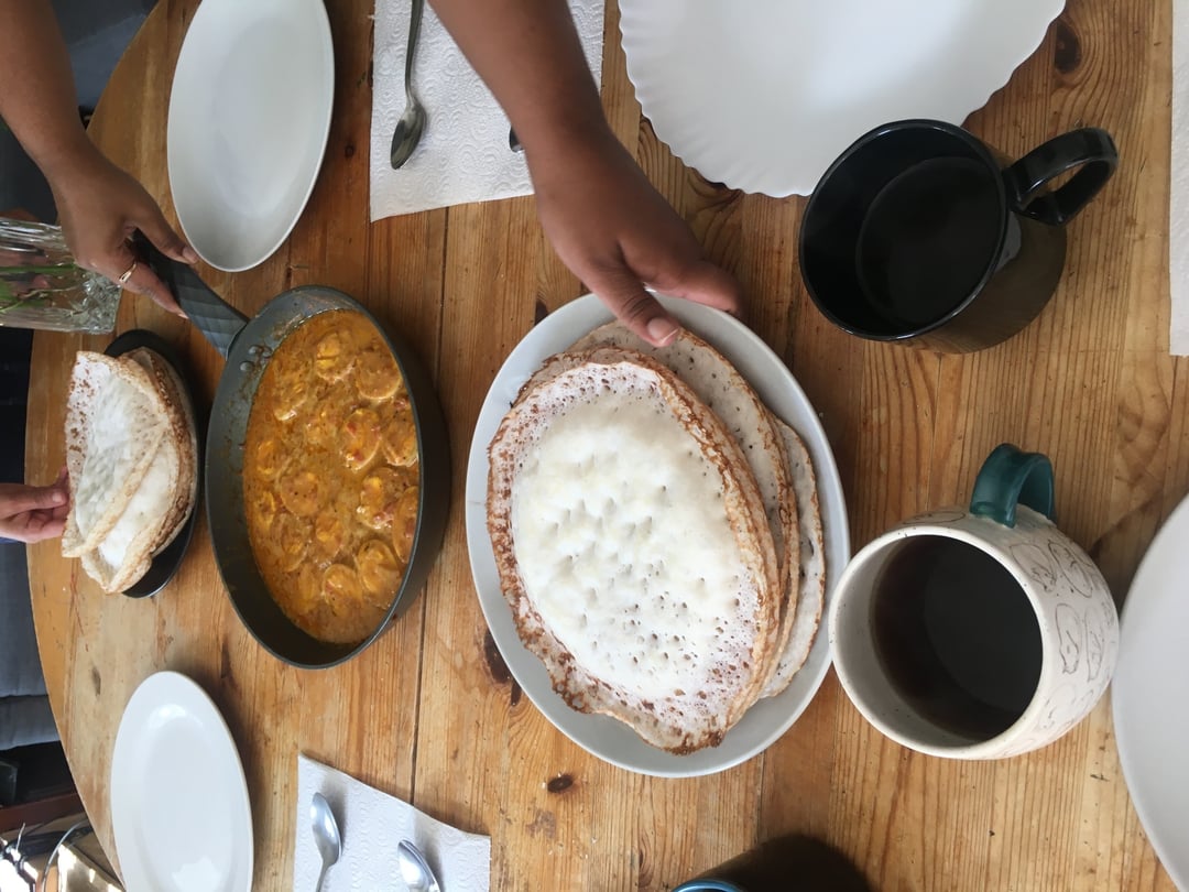 Egg korma and appam - a rice and coconut pancake