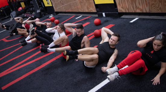 A young girl with weight on her back