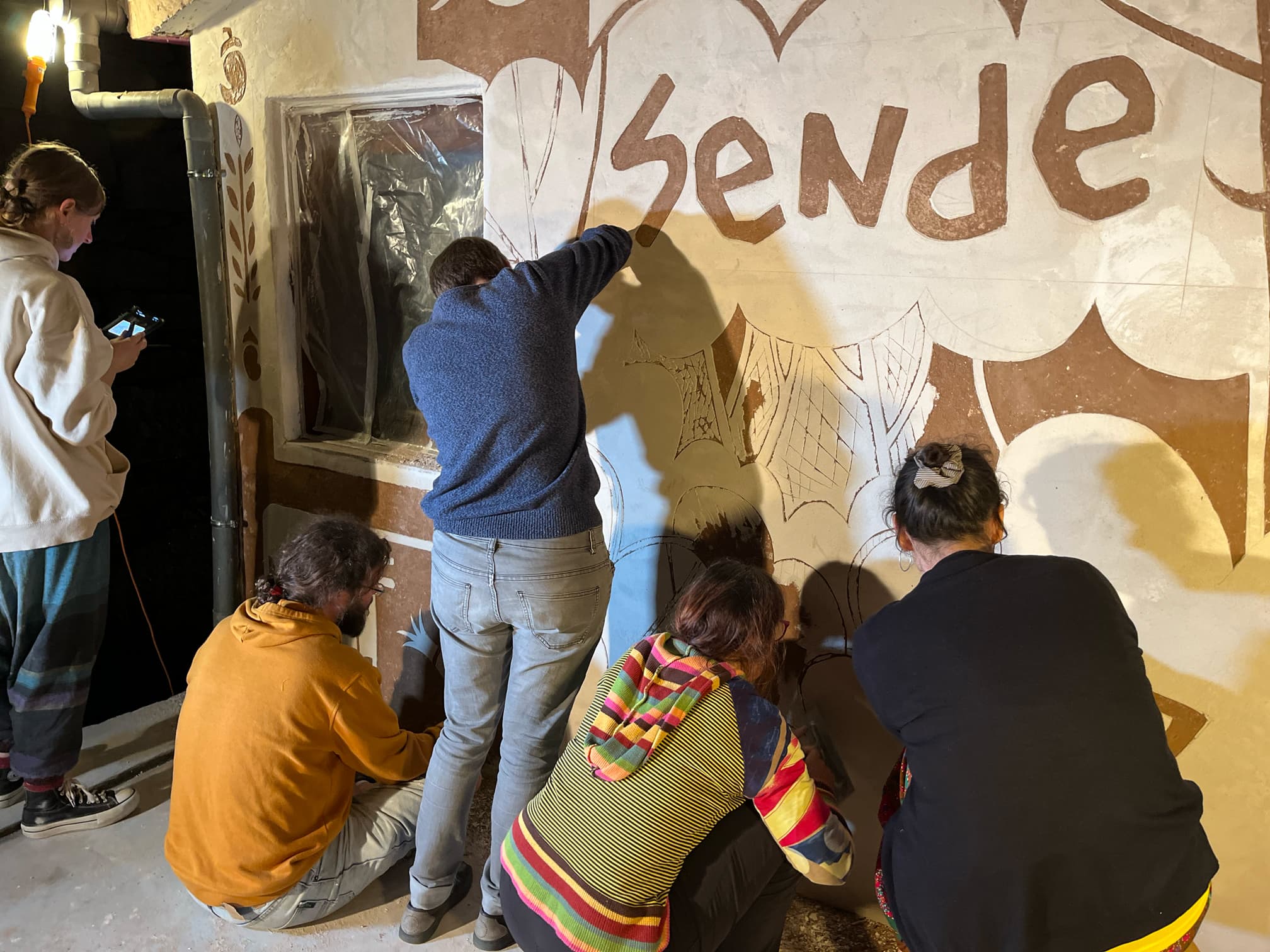 Artists engraving mural