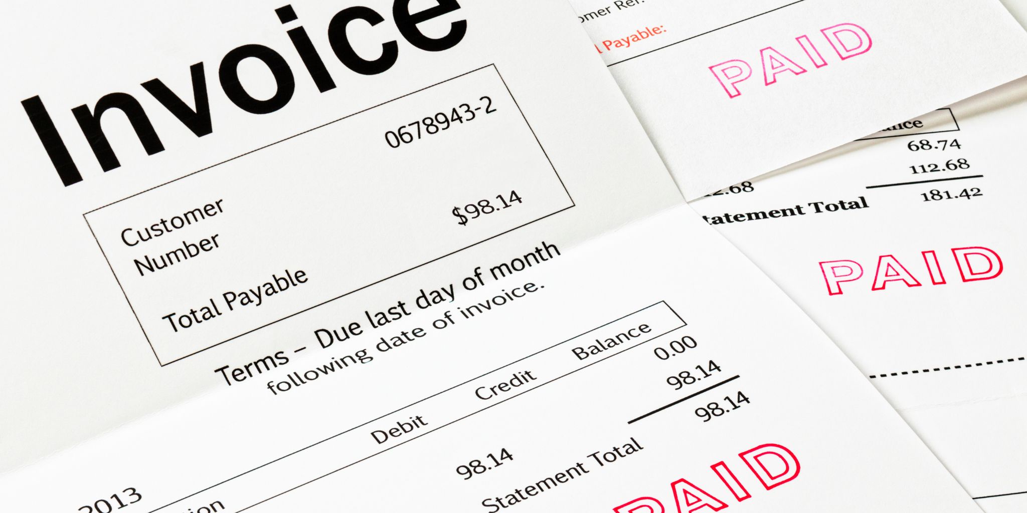 Close-up of an invoice marked 'Paid'