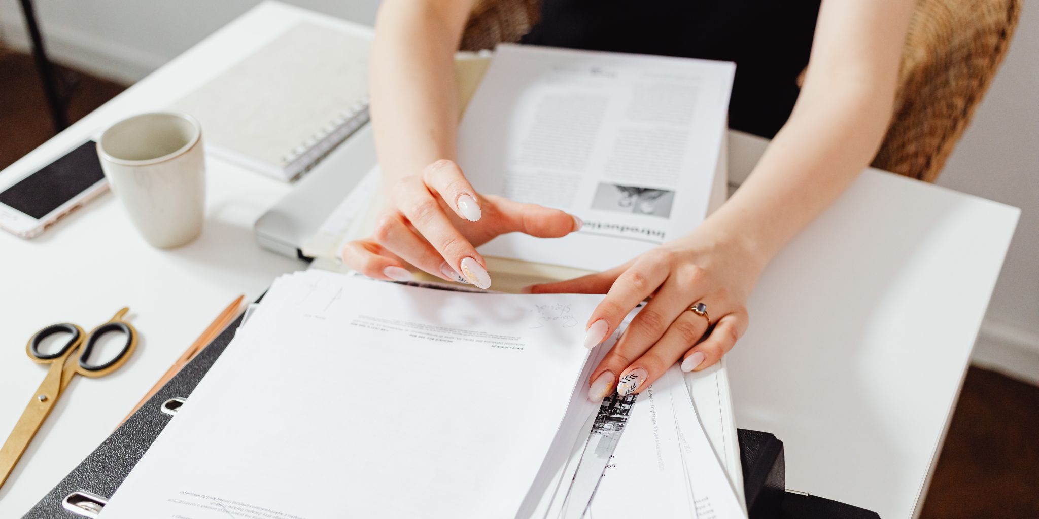 An image of a kitchen table with papers