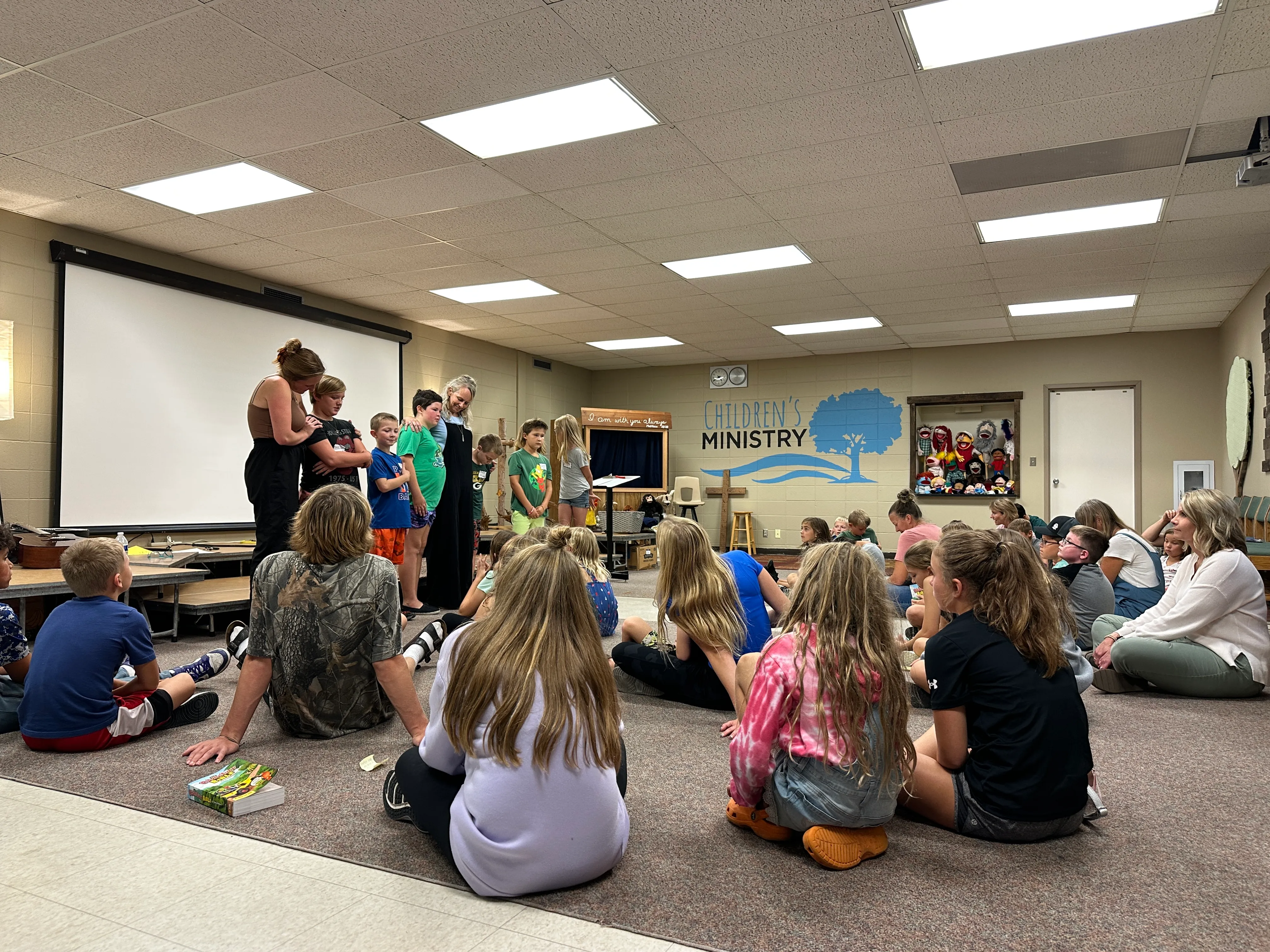 Member of New Heights Church's family faith night shows off their puppetry skills with a big smile