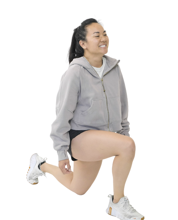 Gymparty member mid lunge, smiling
