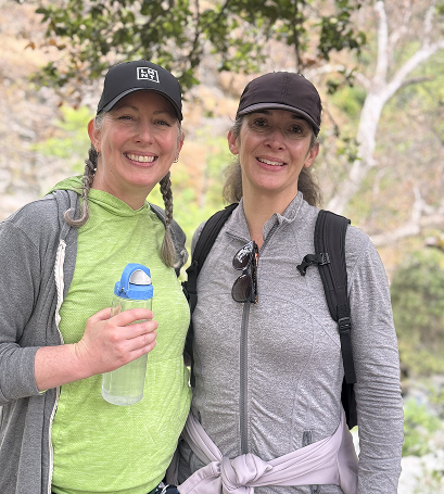 Two Gymparty members smiling during an outdoor walk