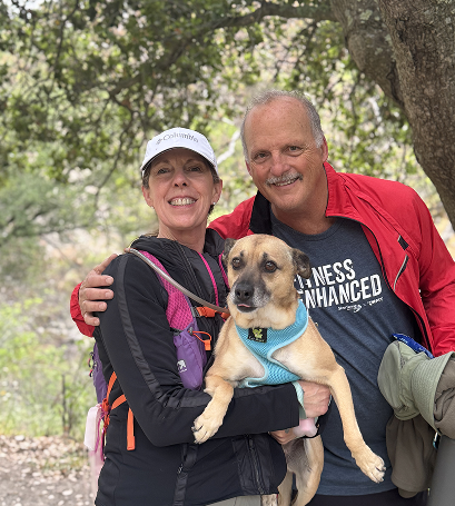 Two Gymparty members on a trail with their dog