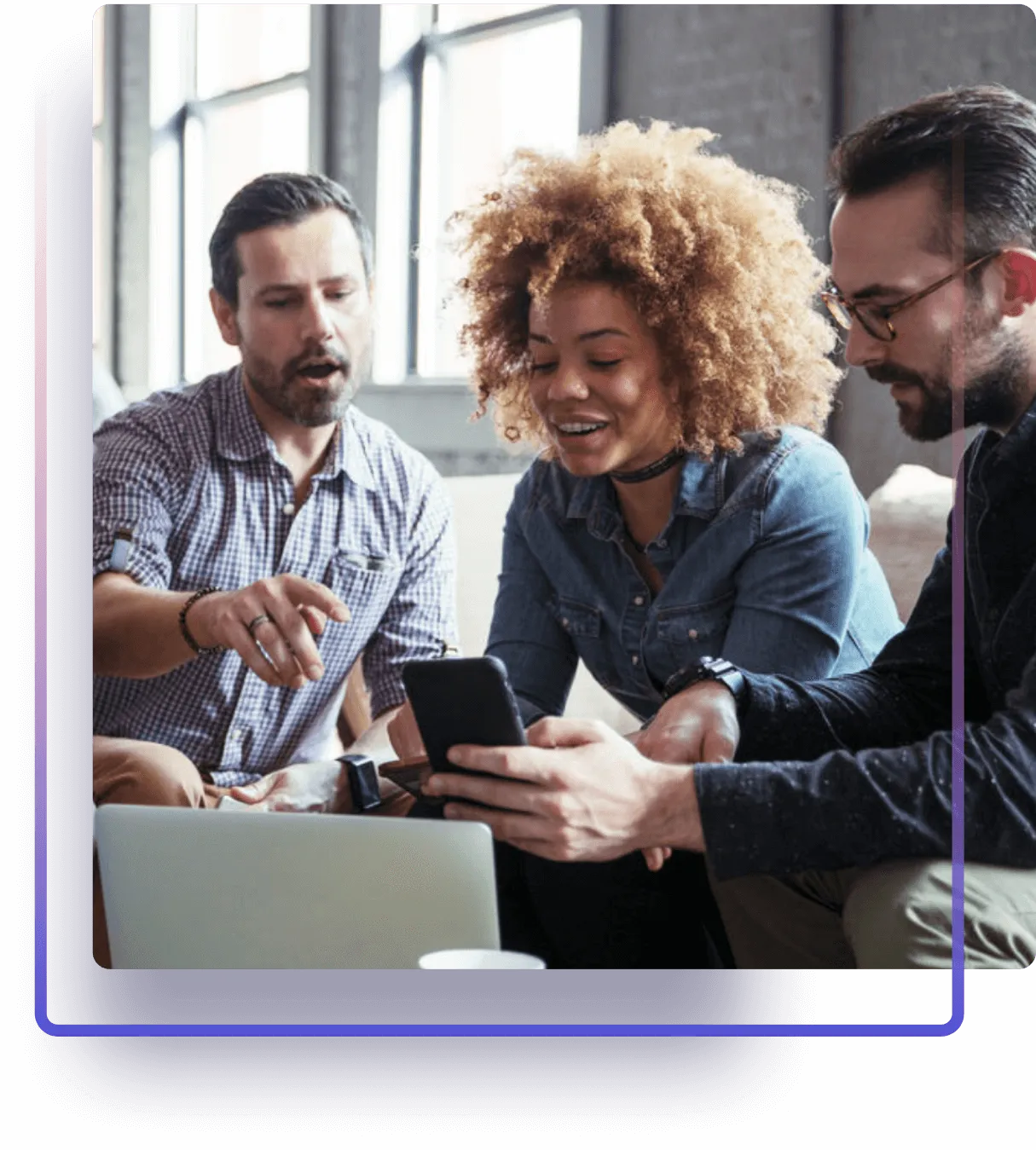 Three employees working at a laptop together, purple gradient frame.