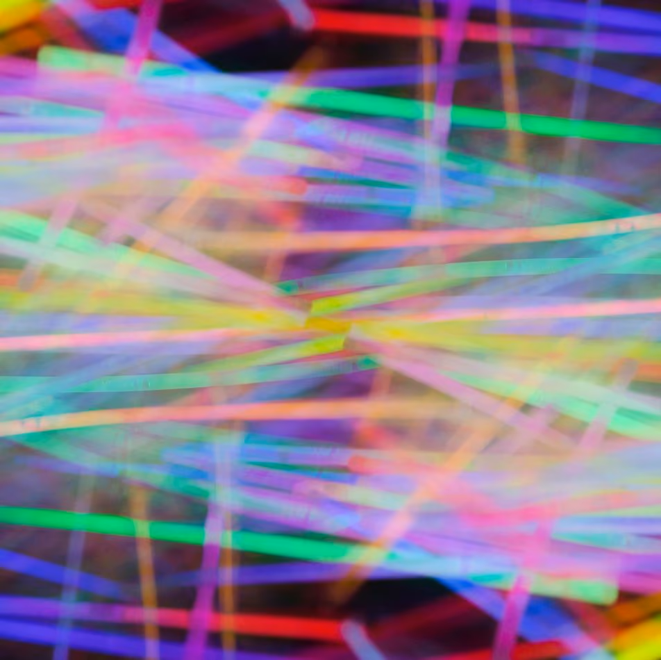 A pile of multi-coloured glow sticks