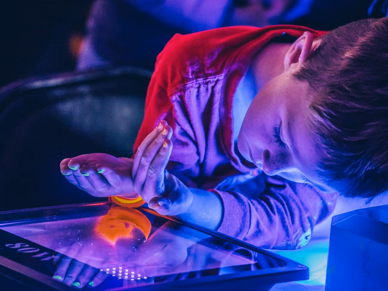 A young child holds up their 