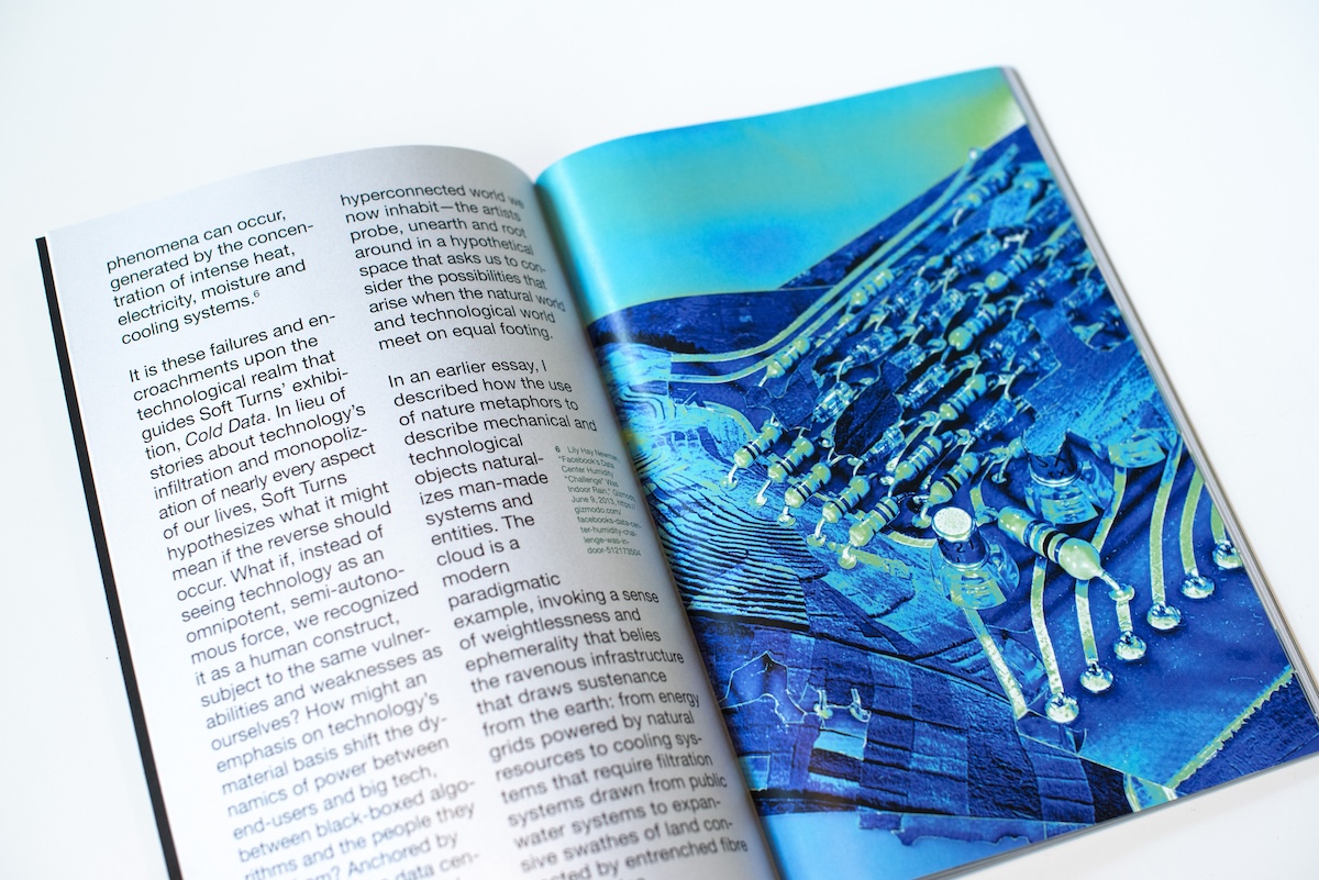 A colour snapshot of author in a swimming pool near the shallow end signage.