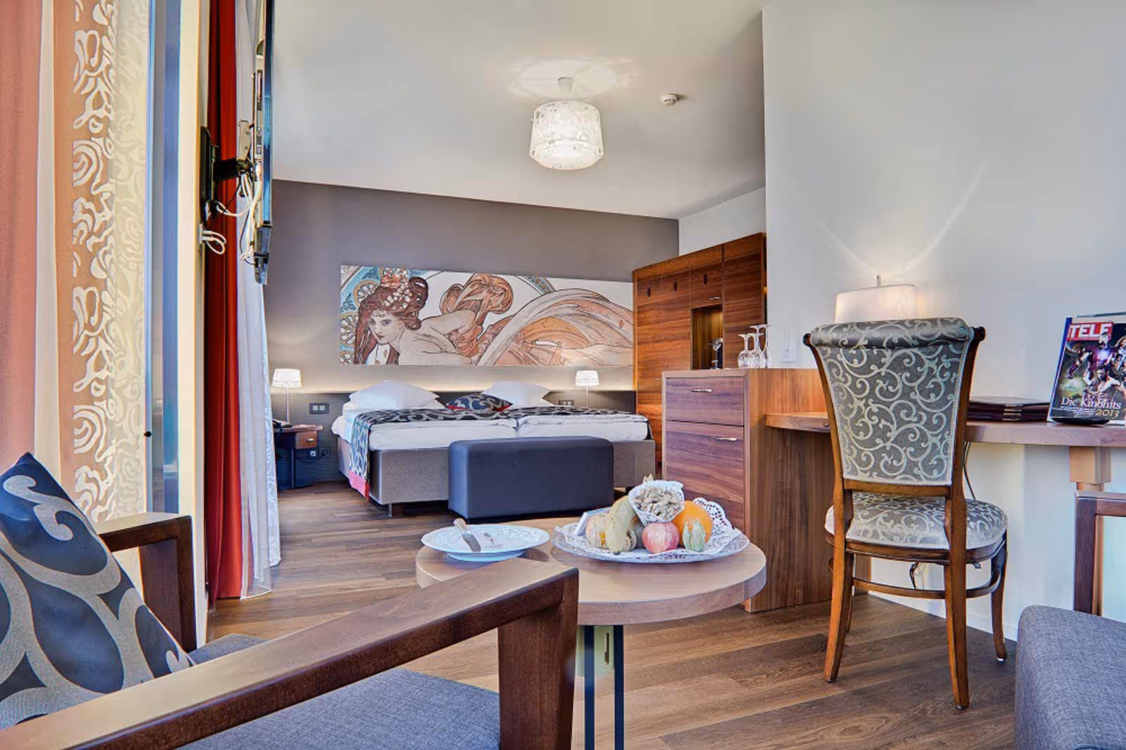 Modern hotel room with large wardrobe, double bed and Nespresso coffee machine