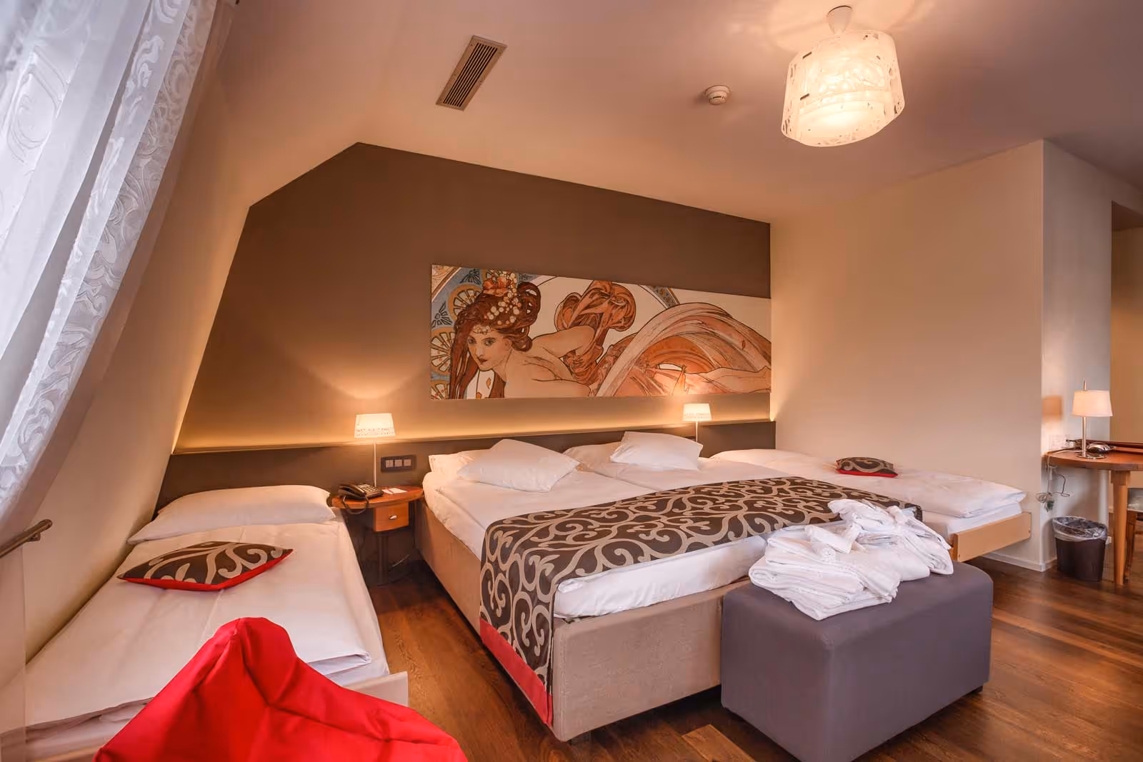 Hotel room in Belle Époque style with double bed and extra bed