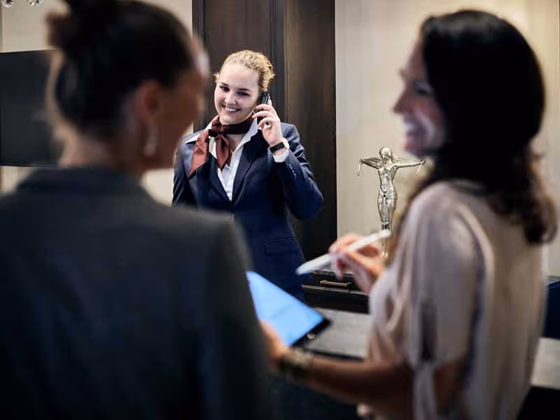 Receptionist welcomes guests