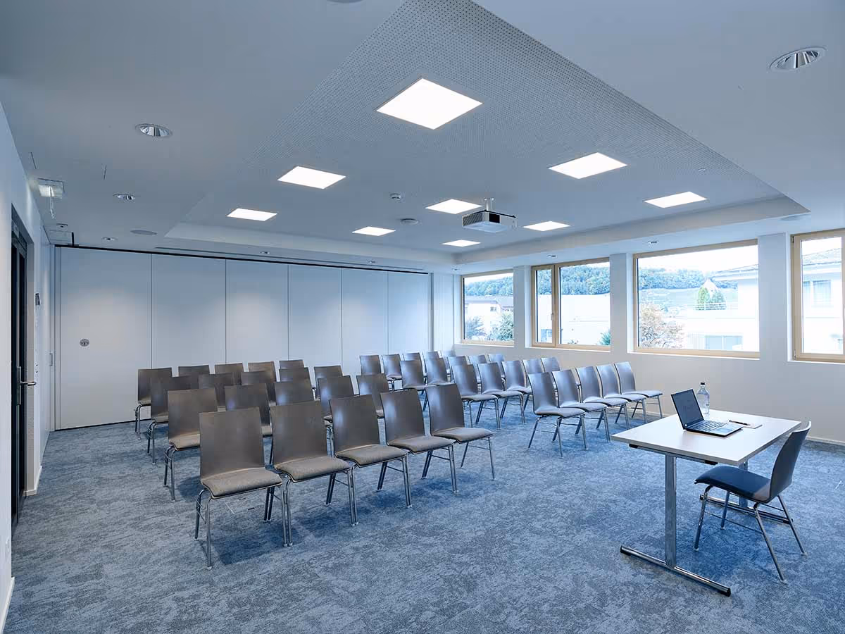 Bright seminar room with parliament seating