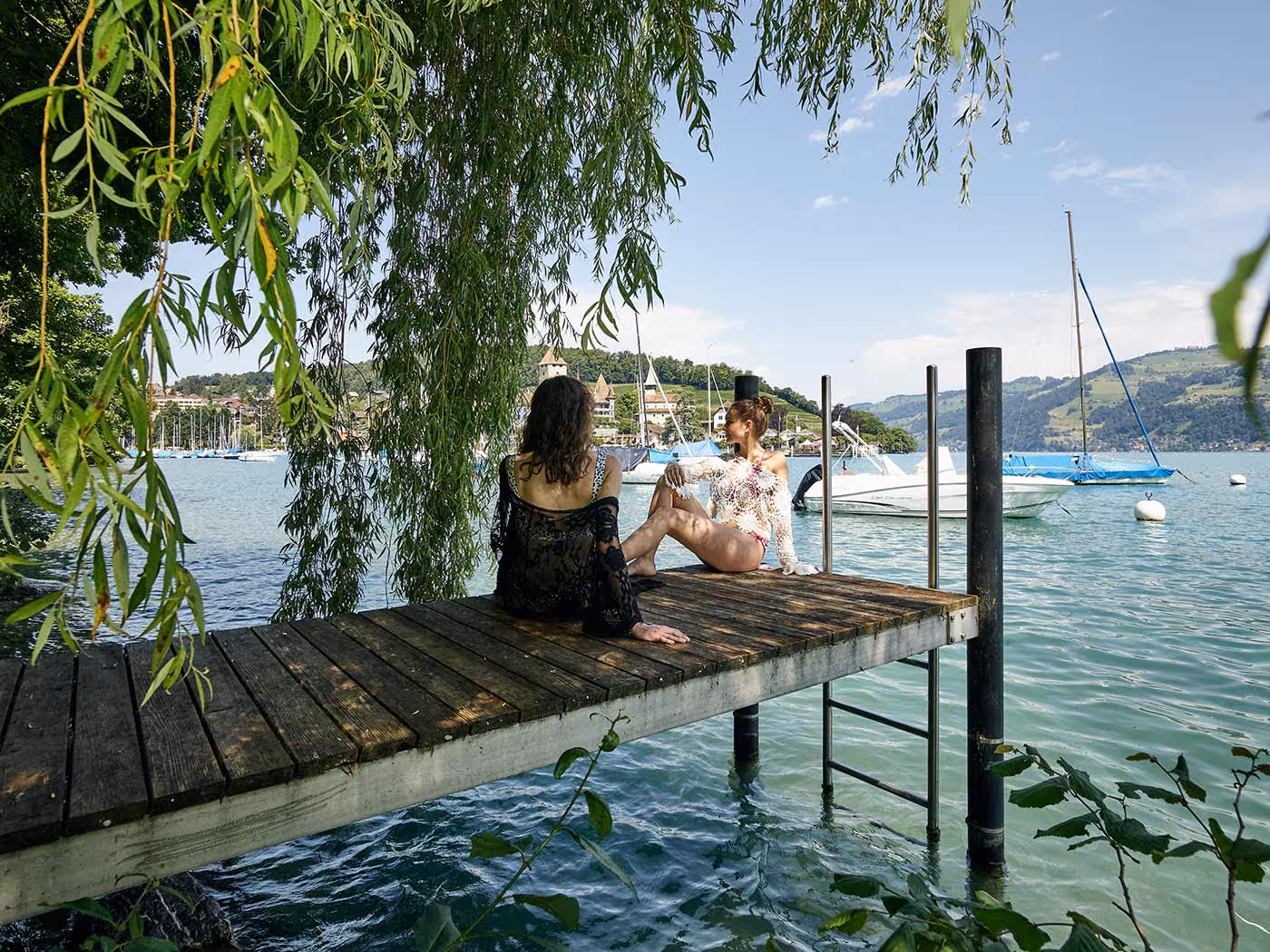 Two women on the jetty at the private lido on Lake Thun