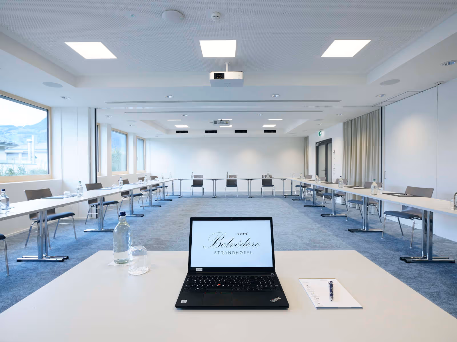 Table and laptop in a seminar room