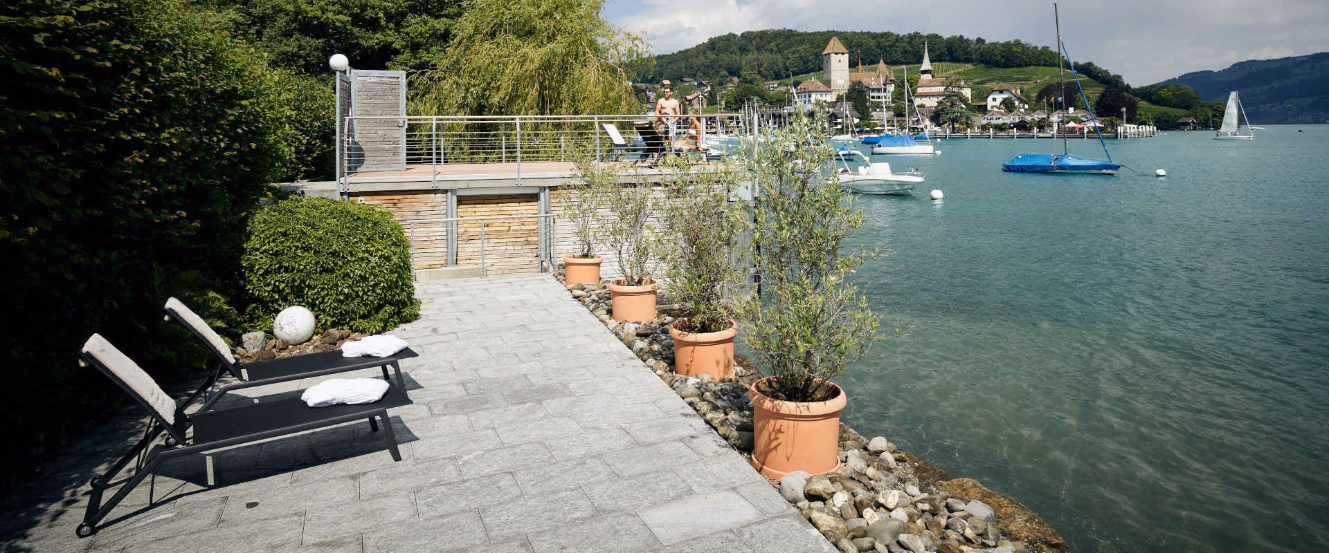 Sun loungers in the private lido by the lake