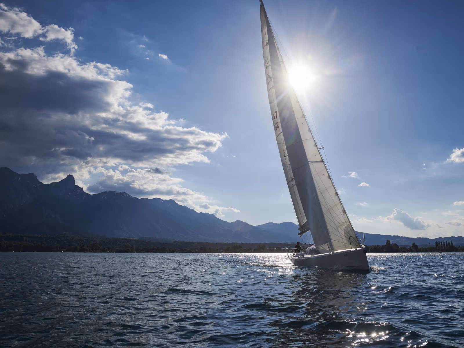 Sailing boat on Lake Thun as the sun sets