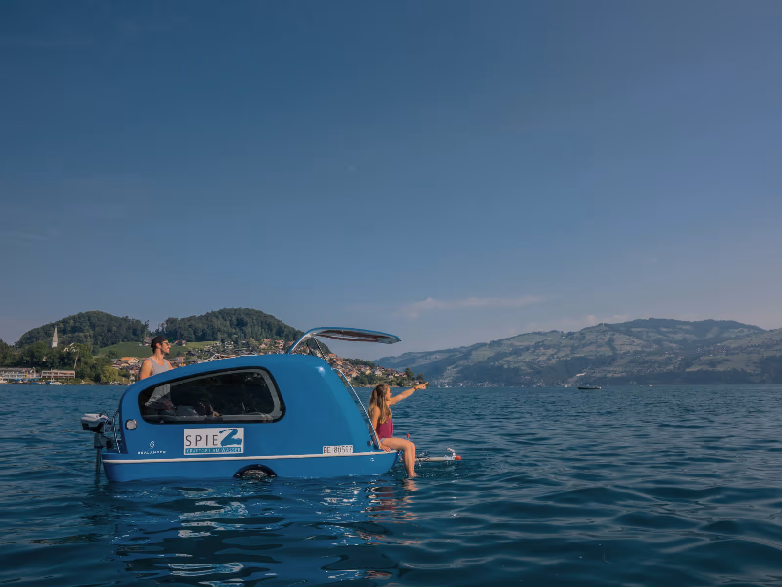Seal tender with 2 people on Lake Thun