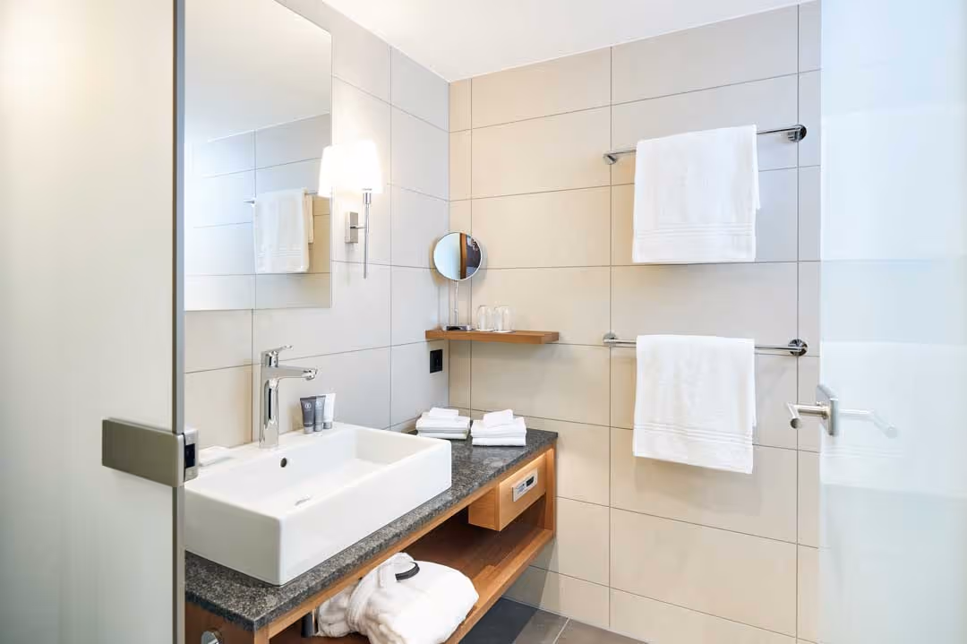 Bright hotel room with window front and desk