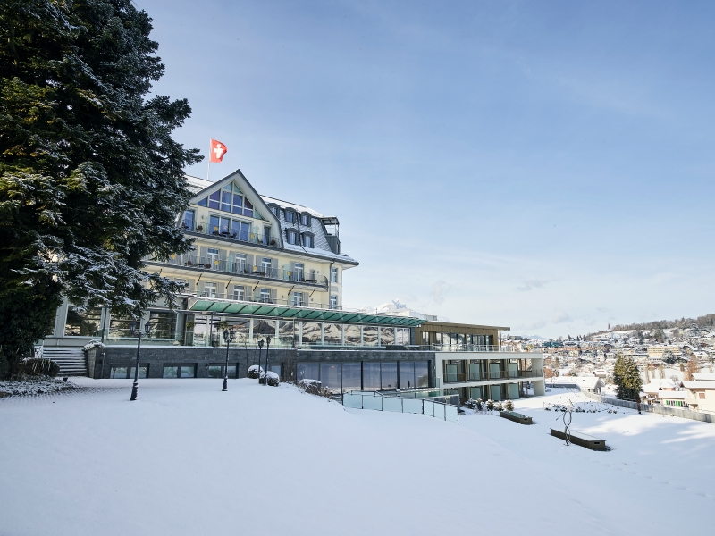 Hotel building at sunset on Lake Thun