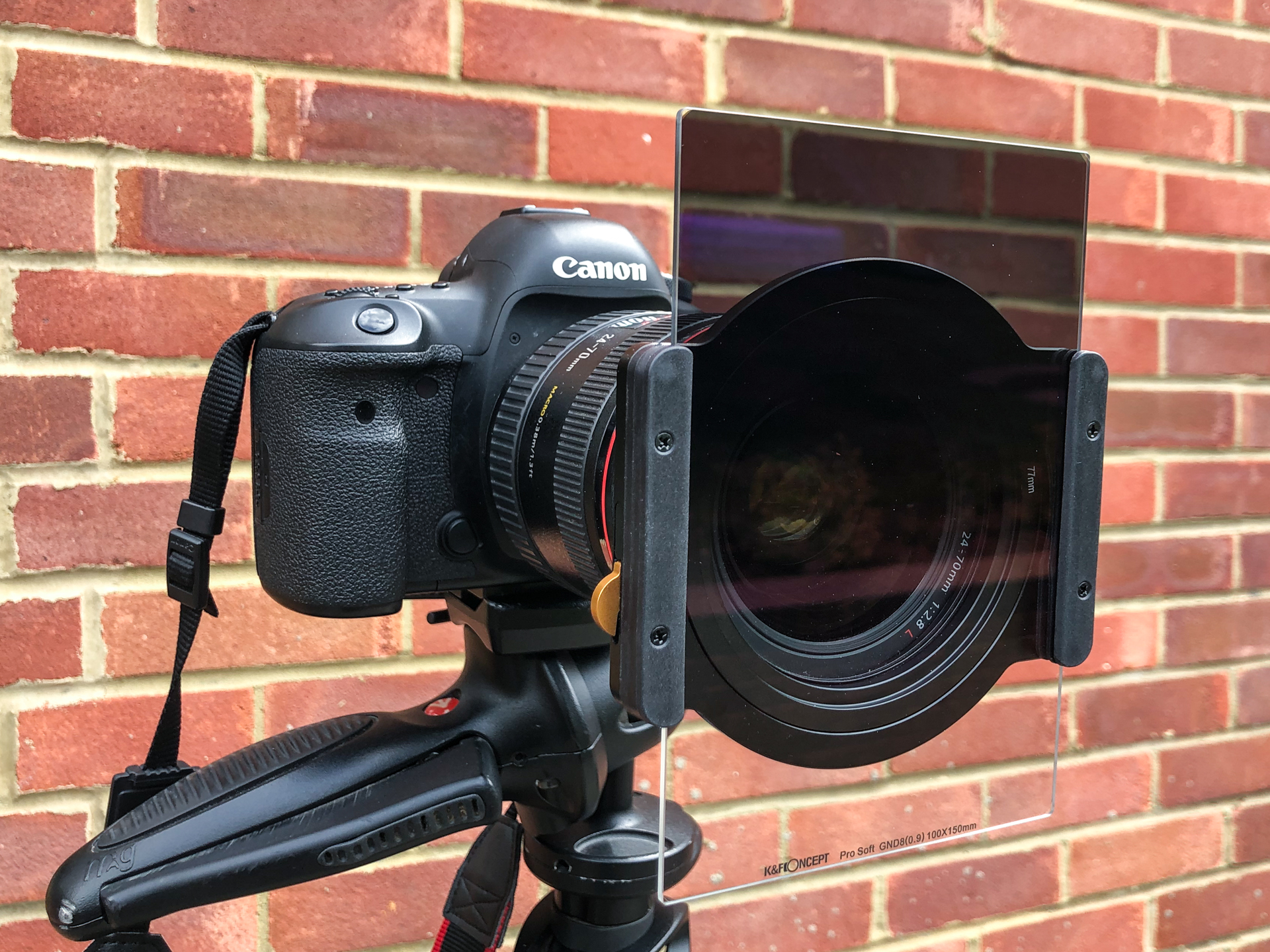 A traditional Graduated Neutral Density filter placed in front of a camera lens