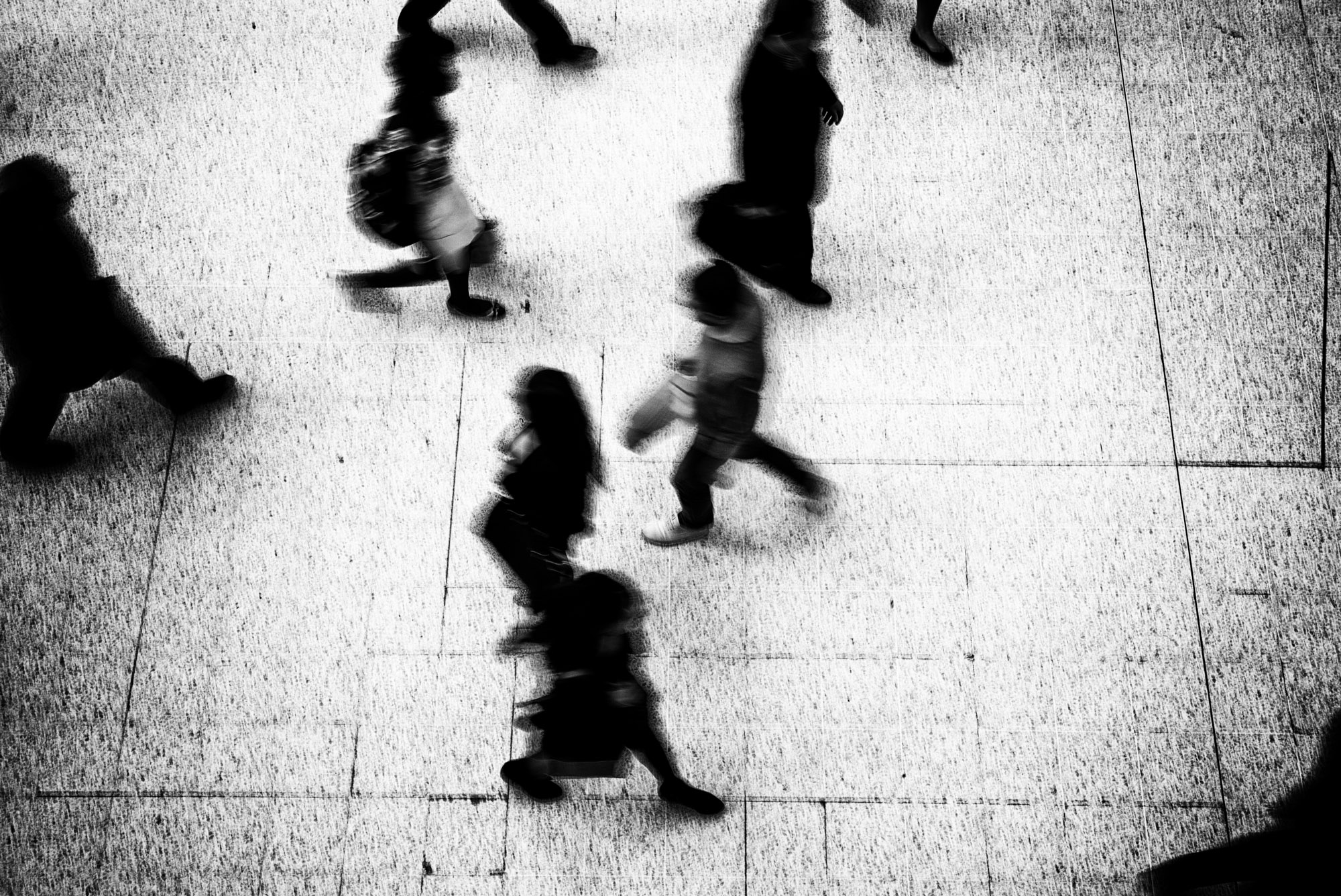 Grainy image of people walking