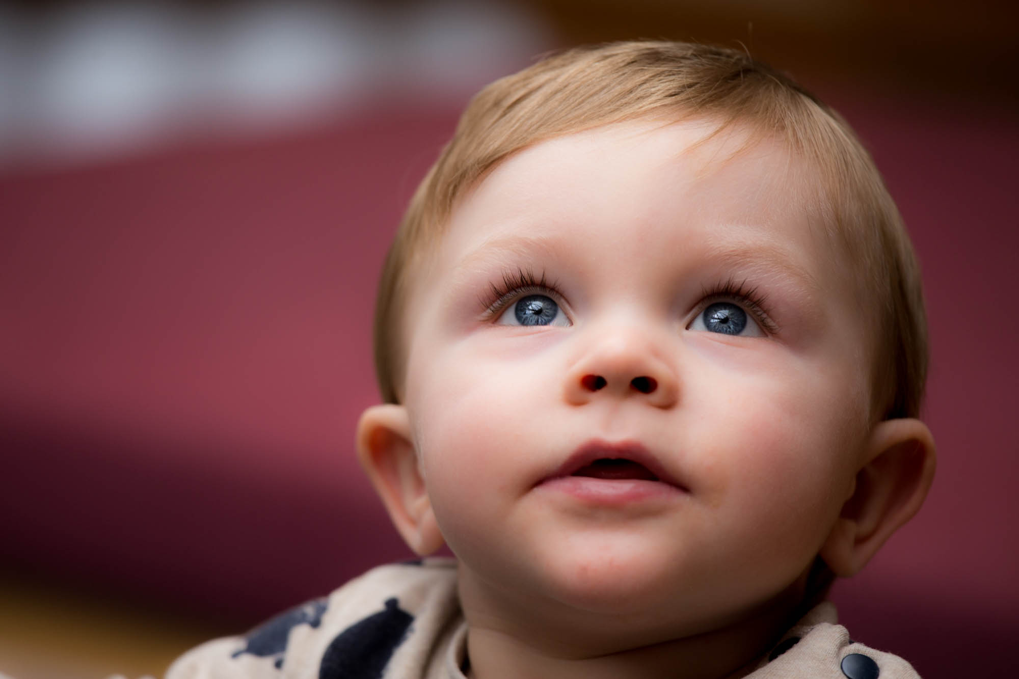 Toddler looking up at a light