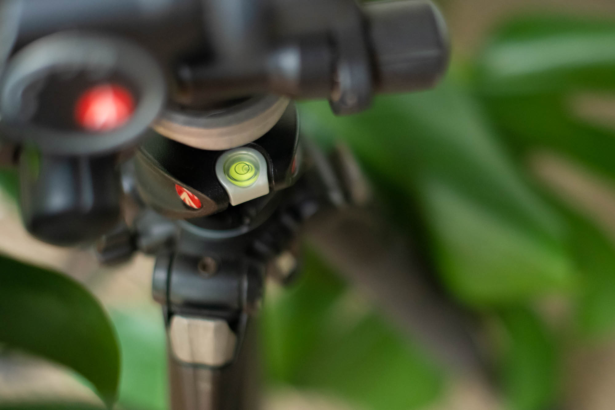 A bubble spirit level on a camera tripod