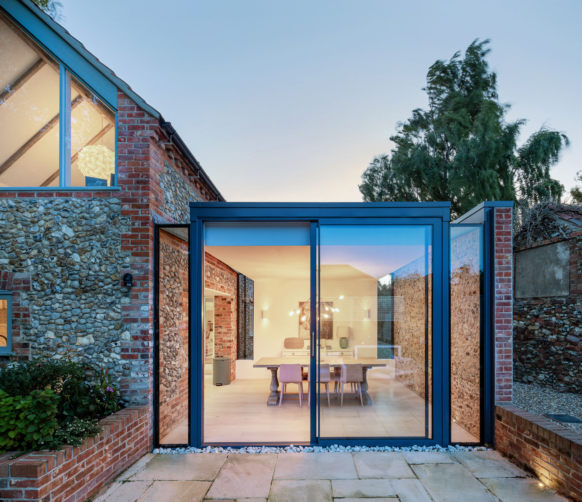 Architectural photography of glass doors leading to a patio captured from a 1-point perspective