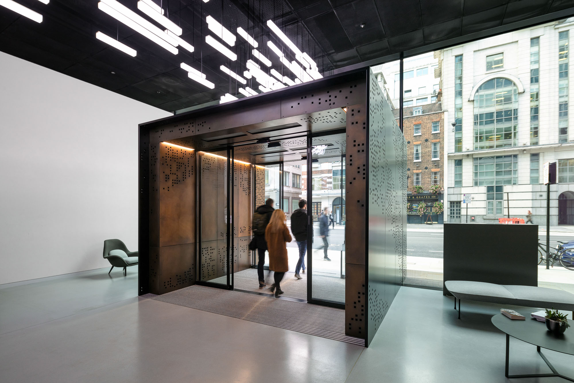 Architectural image of an office hallway with glass doors and windows