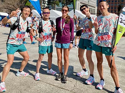 Runners cross the start line in Tokyo