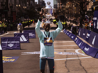 John Korir celebrates winning in Boston in 2025