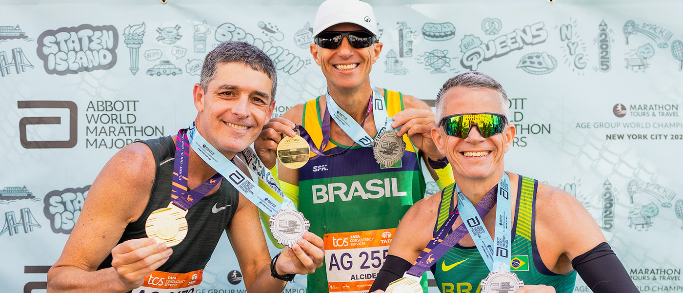 Runners celebrate with their medals in New York