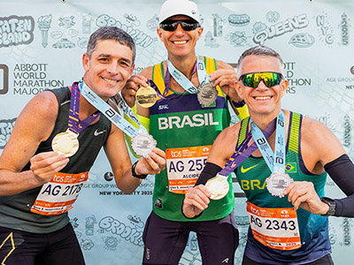 Runners celebrate with their medals in New York