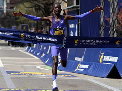 John Korir celebrates winning the Boston Marathon