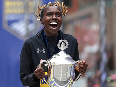 Sharon Lokedi celebrates winning in Boston