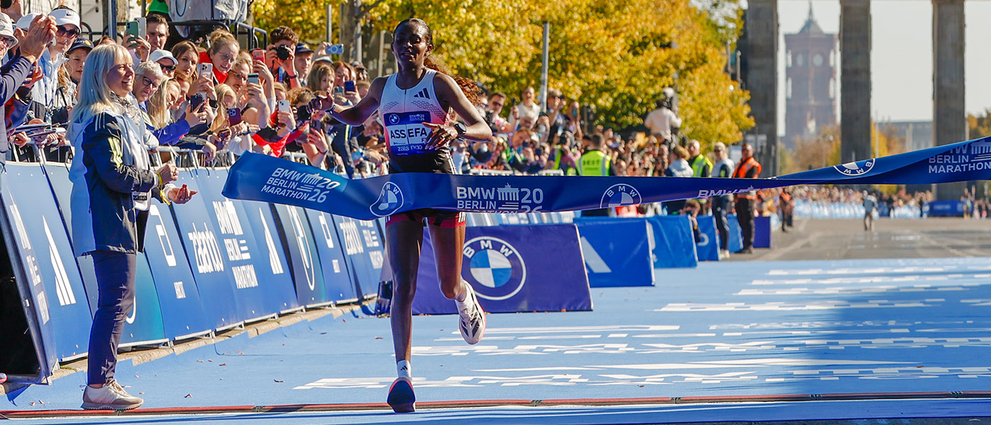 Tigst Assefa crosses the line in Berlin